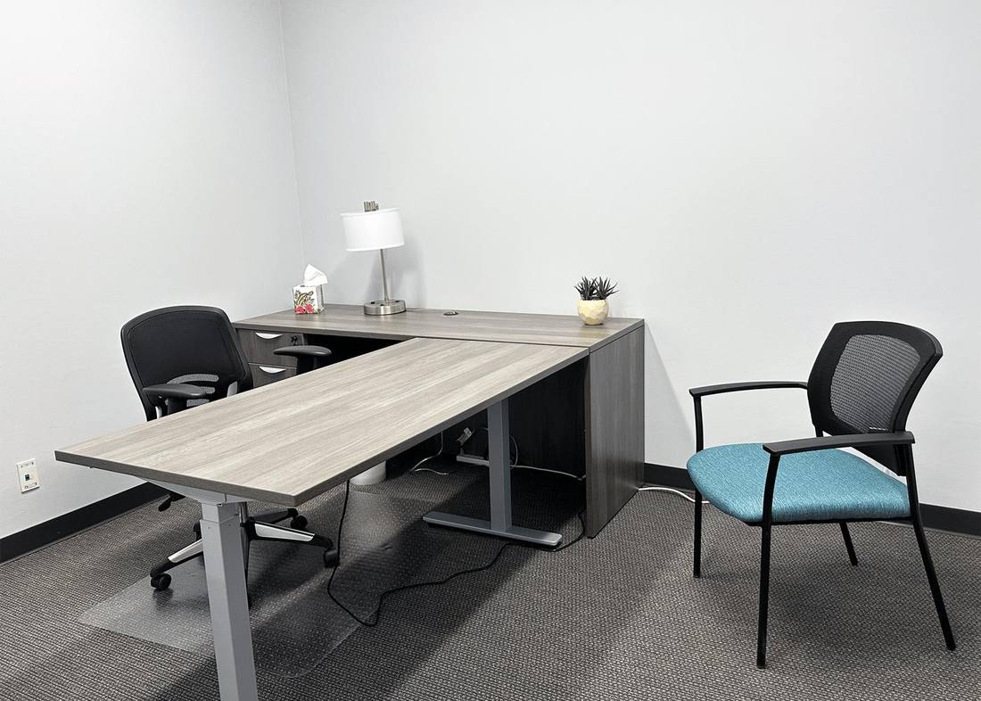 Tunnell private office with L-shaped desk, task chair and guest chair